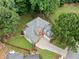 Stunning aerial view of a well-manicured home with lush landscaping and a long, paved driveway at 1440 Boundary Blvd, Suwanee, GA 30024