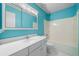 This bathroom has a single vanity with a mirror and a tub with a shower at 1440 Boundary Blvd, Suwanee, GA 30024