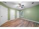 Cozy bedroom with wood floors, fresh paint, and two closets for storage at 1440 Boundary Blvd, Suwanee, GA 30024