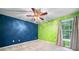 Vibrant bedroom with carpet floors, a ceiling fan, and a bright, colorful design at 1440 Boundary Blvd, Suwanee, GA 30024