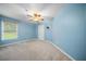 Inviting bedroom with plush carpeting, a ceiling fan, and a large window for natural light at 1440 Boundary Blvd, Suwanee, GA 30024