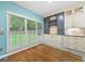 Charming breakfast nook featuring custom cabinets, granite countertops, and a beautiful view of the lush backyard at 1440 Boundary Blvd, Suwanee, GA 30024