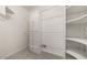 This walk-in closet has wire and custom shelving at 1440 Boundary Blvd, Suwanee, GA 30024