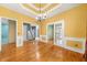 Bright dining room has beautiful hardwood floors, yellow walls, and white trim at 1440 Boundary Blvd, Suwanee, GA 30024