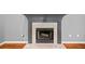 Living room fireplace with gray trim, beautiful hearth, and ready to warm up those cold nights at 1440 Boundary Blvd, Suwanee, GA 30024