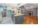 Kitchen with a large island, granite countertops, stainless steel appliances, and an open concept at 1440 Boundary Blvd, Suwanee, GA 30024