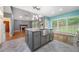 Kitchen with a large island, stainless steel appliances, and an open view to the living room at 1440 Boundary Blvd, Suwanee, GA 30024