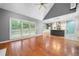 Open-concept living room leading into kitchen with bright windows overlooking the backyard at 1440 Boundary Blvd, Suwanee, GA 30024