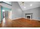 Living room featuring a soaring ceiling, fireplace, and access to other parts of the home at 1440 Boundary Blvd, Suwanee, GA 30024