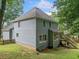 Charming two-story home featuring light gray siding, a cozy deck, and a well-maintained yard at 1440 Boundary Blvd, Suwanee, GA 30024