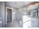 Elegant bathroom with a glass-enclosed shower, marble accents, and a well-lit vanity area at 1741 Prospect Way, Conyers, GA 30094