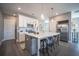 Bright kitchen with white cabinets, stainless steel appliances, and a large island with seating at 1741 Prospect Way, Conyers, GA 30094