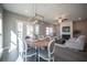Open living space with a fireplace and dining area, providing a comfortable and inviting atmosphere at 1741 Prospect Way, Conyers, GA 30094