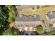 An aerial view of a charming home showcasing its well-maintained roof, private driveways and lush surroundings at 2205 Hoskin Nw Ct # 9, Kennesaw, GA 30144