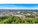 Expansive aerial view with lush greenery, capturing nearby shopping centers and a glimpse of the city skyline at 2205 Hoskin Nw Ct # 9, Kennesaw, GA 30144
