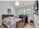 Bright bedroom with a queen bed, hardwood floors, ceiling fan and plenty of natural light at 2205 Hoskin Nw Ct # 9, Kennesaw, GA 30144