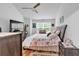 Bright bedroom with a queen bed, hardwood floors, ceiling fan and plenty of natural light at 2205 Hoskin Nw Ct # 9, Kennesaw, GA 30144