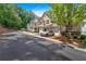 Attractive townhomes with attached garages on a well-kept street, surrounded by lush greenery at 2205 Hoskin Nw Ct # 9, Kennesaw, GA 30144