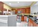 Well-equipped kitchen boasts stainless steel appliances, granite countertops, and ample cabinet space for the home chef at 2205 Hoskin Nw Ct # 9, Kennesaw, GA 30144