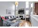 Inviting living space featuring high ceilings, hardwood floors, a fireplace, and stylish decor at 2205 Hoskin Nw Ct # 9, Kennesaw, GA 30144