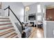 Bright living area with hardwood floors, high ceilings, a fireplace, and large windows offering natural light at 2205 Hoskin Nw Ct # 9, Kennesaw, GA 30144