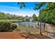 Aerial view of a community pool, clubhouse, and walkway, surrounded by trees at 2205 Hoskin Nw Ct # 9, Kennesaw, GA 30144