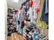 Walk-in closet with organizing shelves, hanging racks, and storage space for clothes and shoes at 2205 Hoskin Nw Ct # 9, Kennesaw, GA 30144