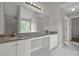 Bathroom featuring double vanity with granite countertops, undermount sinks, and large mirror at 3885 Riverview Chase Blf, Ellenwood, GA 30294