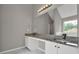 Bathroom with granite countertop vanity, a large mirror, and modern lighting at 3885 Riverview Chase Blf, Ellenwood, GA 30294