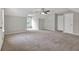 A spacious room with carpet floors, neutral walls, ceiling fan and a double door closet at 3885 Riverview Chase Blf, Ellenwood, GA 30294