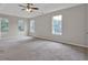 Bright bedroom with carpet flooring, neutral walls, and multiple windows for natural light at 3885 Riverview Chase Blf, Ellenwood, GA 30294
