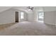 Spacious bedroom features neutral paint, carpet flooring, bright windows and a ceiling fan at 3885 Riverview Chase Blf, Ellenwood, GA 30294