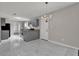 Modern kitchen featuring gray cabinets, granite countertops, stainless steel appliances, and a stylish chandelier at 3885 Riverview Chase Blf, Ellenwood, GA 30294