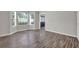 Inviting living room with abundant natural light from bay windows and sleek flooring at 3885 Riverview Chase Blf, Ellenwood, GA 30294