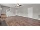 Spacious living room showcasing hardwood floors, staircase, and natural light at 3885 Riverview Chase Blf, Ellenwood, GA 30294