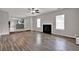 Open floor plan shows living area with fireplace and a view of the kitchen at 3885 Riverview Chase Blf, Ellenwood, GA 30294