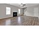 Living room boasts hardwood floors, a fireplace, and staircase at 3885 Riverview Chase Blf, Ellenwood, GA 30294
