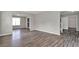Living area offers wood floors, neutral color palette, and seamless access to additional rooms at 3885 Riverview Chase Blf, Ellenwood, GA 30294