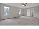 Spacious main bedroom with tray ceiling, ceiling fan, and plenty of natural light at 3885 Riverview Chase Blf, Ellenwood, GA 30294