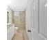 Bathroom featuring a glass enclosed tile shower, decorative tile floor border, and granite vanity at 4 Mount Vernon Cir, Atlanta, GA 30338