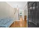 Inviting foyer with hardwood floors, a staircase, and a bench, creating a warm and welcoming atmosphere at 4 Mount Vernon Cir, Atlanta, GA 30338