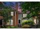Charming townhome exterior featuring brick accents, green siding, and a beautifully landscaped walkway at 4 Mount Vernon Cir, Atlanta, GA 30338