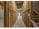 Unfinished basement shows studs and concrete flooring, offering potential for customization at 741 Cams Crk, Mcdonough, GA 30253