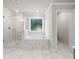 Luxurious bathroom with a glass-enclosed shower and soaking tub at 741 Cams Crk, Mcdonough, GA 30253