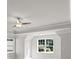 A bedroom suite with a ceiling fan, large window, and tray ceiling at 741 Cams Crk, Mcdonough, GA 30253