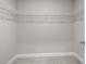 Spacious walk-in closet with built-in shelving and ample storage space at 741 Cams Crk, Mcdonough, GA 30253