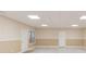 Spacious basement with natural light, neutral-toned walls, modern vinyl plank flooring, and one window at 4235 Crestwood Bend Cir, Buford, GA 30518