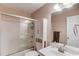 Cozy full bathroom featuring a shower-tub combination with glass sliding doors, vanity, and medicine cabinet at 4235 Crestwood Bend Cir, Buford, GA 30518