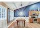 Bright dining area featuring wood floors, natural light, and an adjacent kitchen area at 4235 Crestwood Bend Cir, Buford, GA 30518