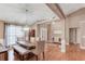 Dining room showcasing hardwood floors, modern lighting, and ample seating at 4235 Crestwood Bend Cir, Buford, GA 30518